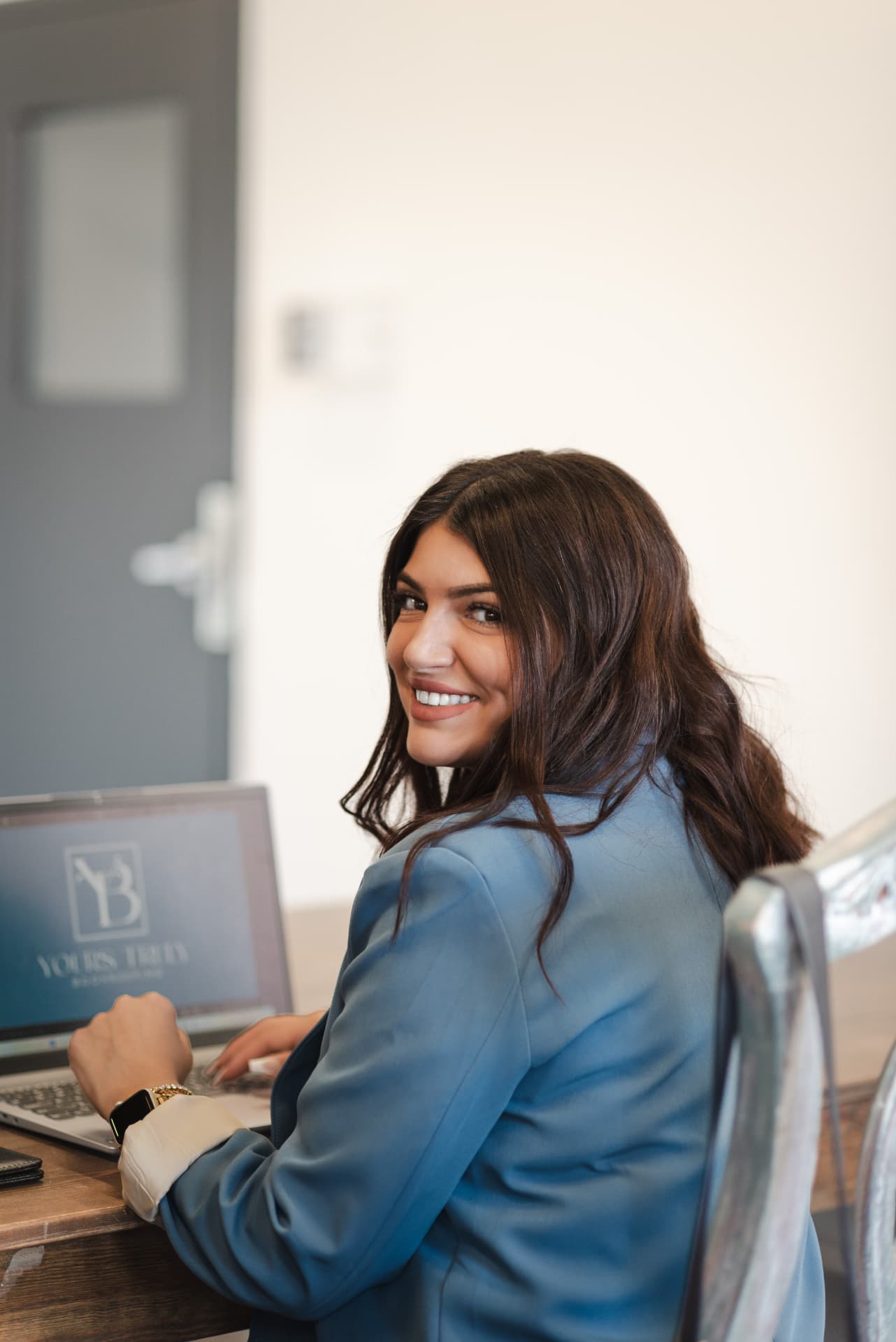Rhea working at her desk